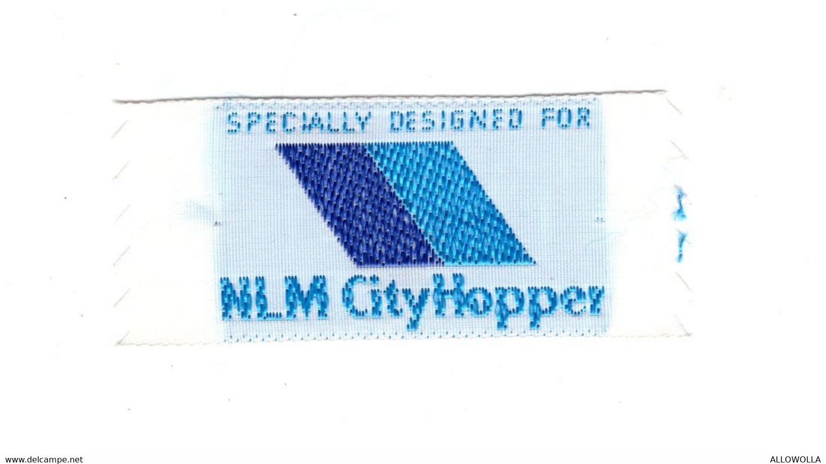 13809" NLM CITYHOPPER  (DUTCH COMMUTER AIRLINE)-TEXTIEL GEWEVEN " Cm. 2,8 X 6,5 - Werbung