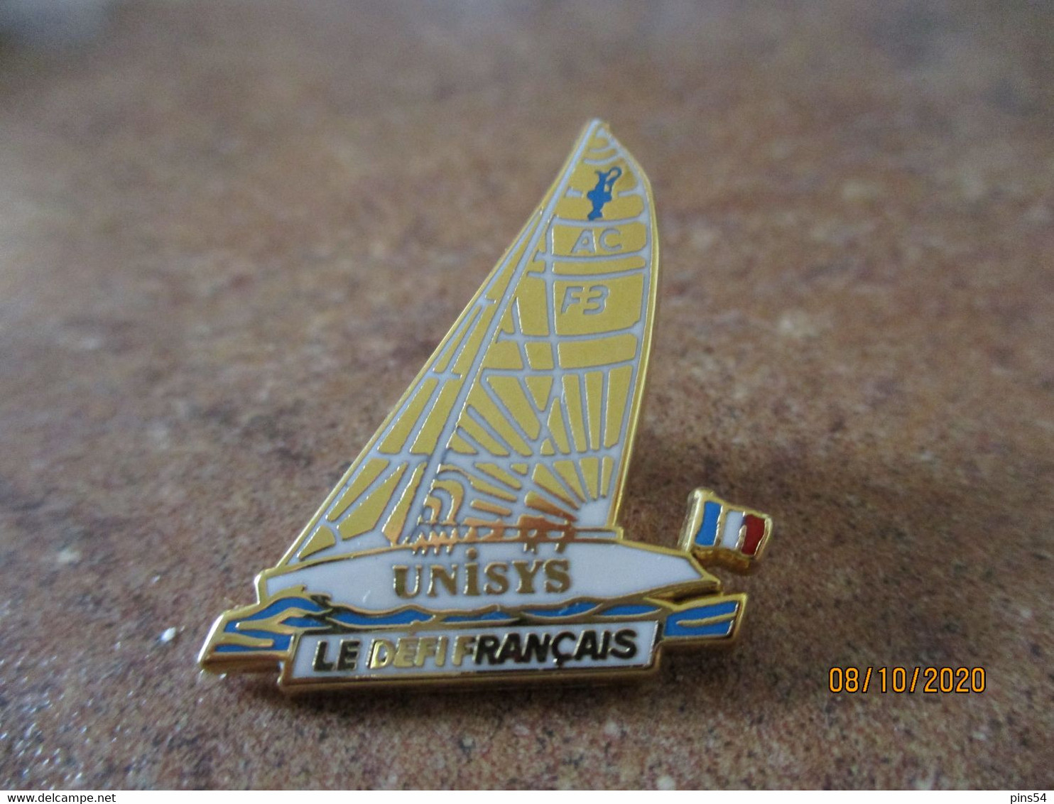 Pin's Neuf Arthus Bertrand Unisys Le Defi Francais - Arthus Bertrand