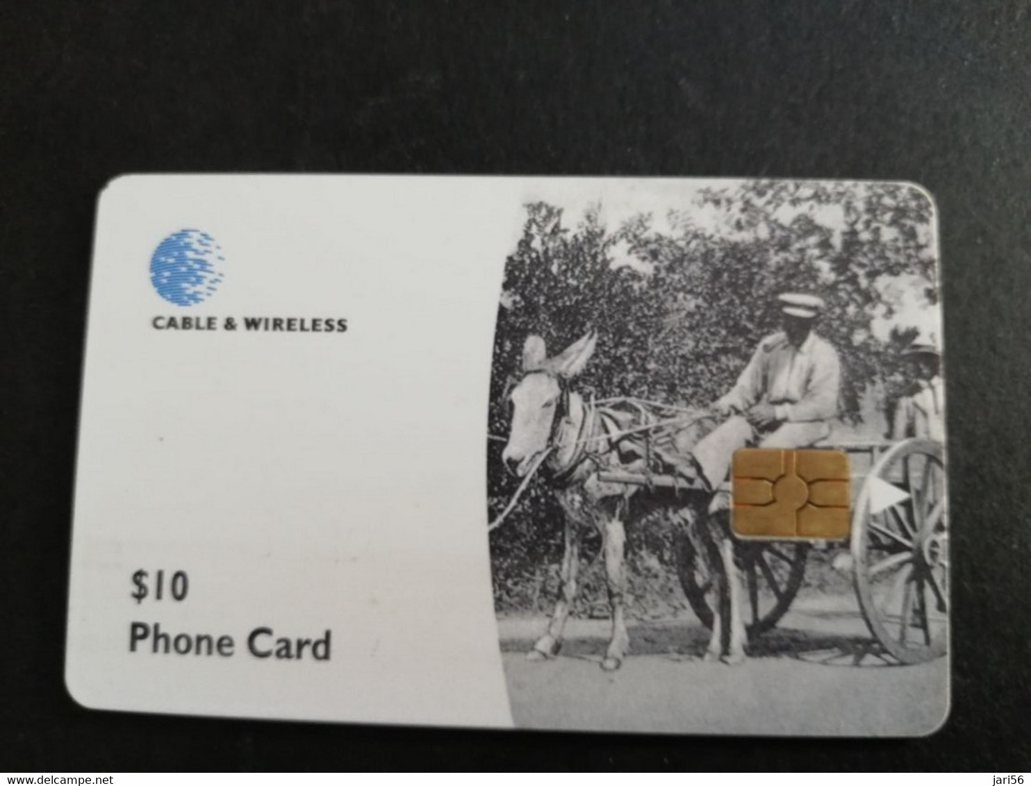 DOMINICA / $10 CHIPCARD  MAN IN CAR WITH DONKEY         Fine Used Card  ** 6283 ** - Dominique