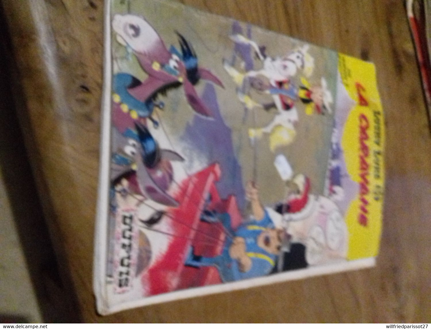 10/ LUCKY LUKE N° 24 LA CARAVANE DUPUIS OFFERT PAR LE RESEAU TOTAL MAUVAIS ETAT - Lucky Luke