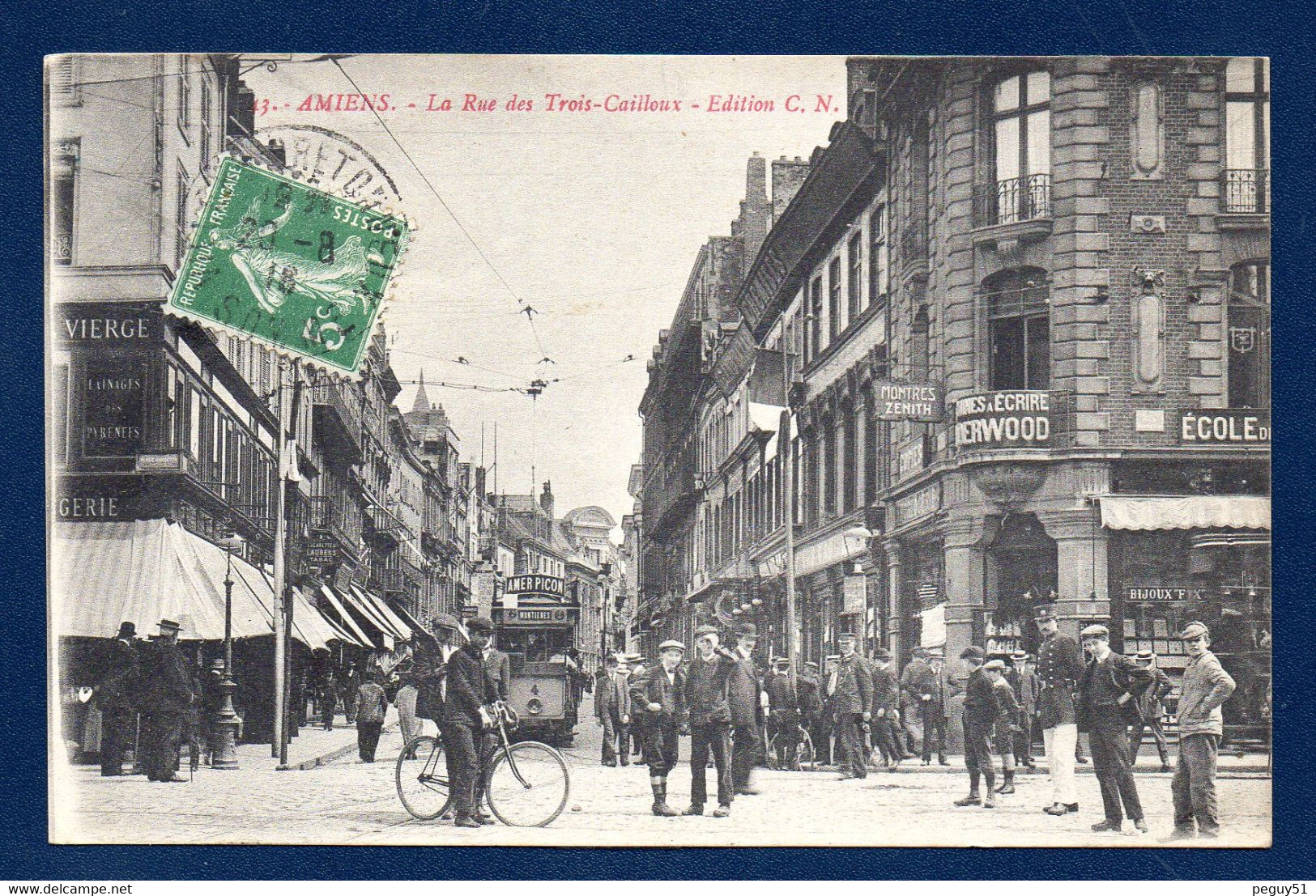 80. Amiens. Rue Des Trois Cailloux. Tramway Montières ( Amer Picon). Machines à écrire Underwood. Montres Zenith. 1916 - Amiens