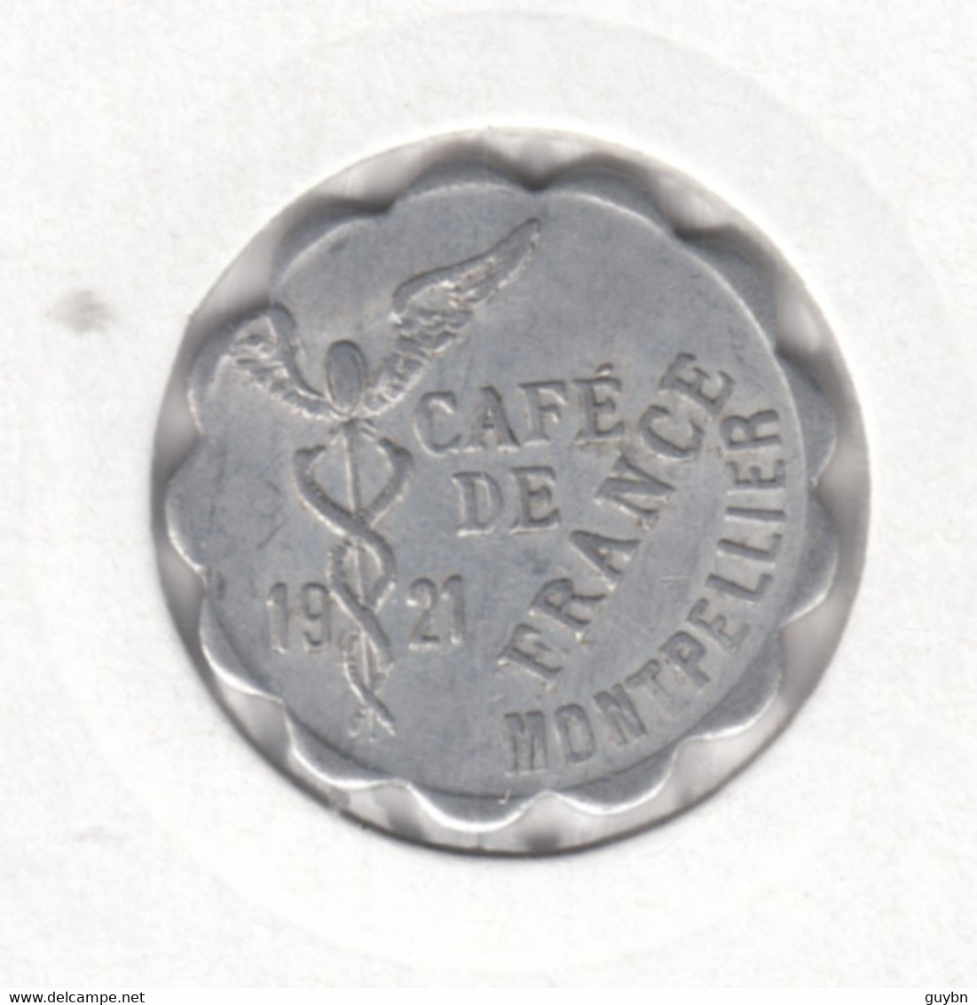 £ Montpellier (34) Hérault . Café De France Place Comédie  . 10 C  . Jeton Monnaie Nécessité .. Aluminium Ron Lobé 21 Mm - Monétaires / De Nécessité