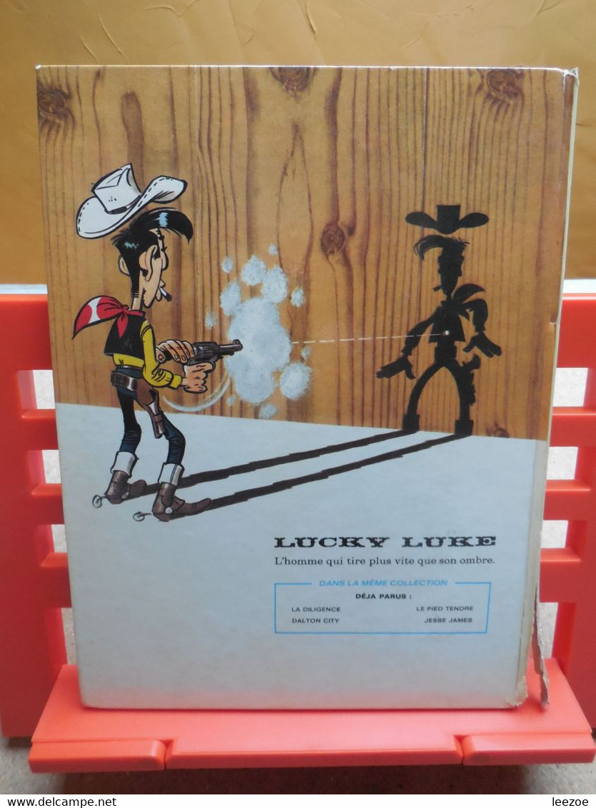 EO Lucky Luke Jesse James, Lombard + Objet Dérivés BD L'Arnaque.C302.22 - Lucky Luke