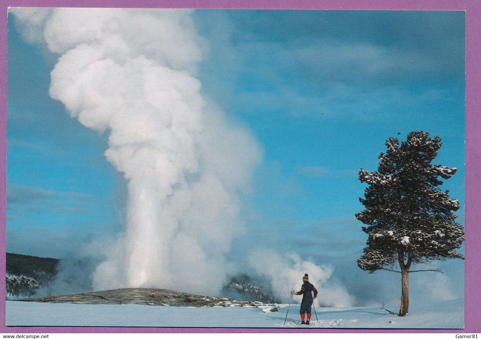 SKIER AND OLD FAITHFUL GEYSER - Yellowstone National Park - Yellowstone