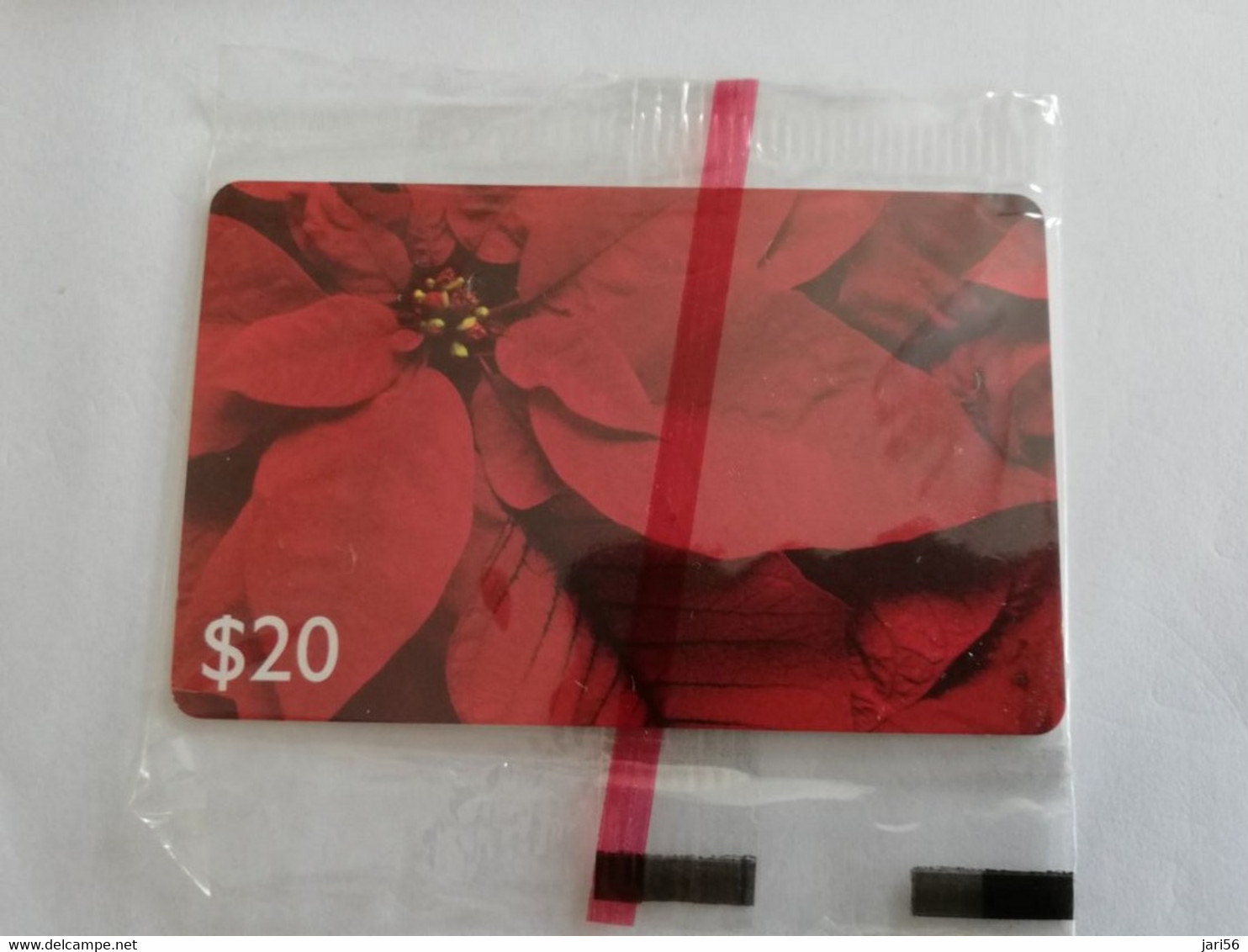 GRENADA  $ 20,- CHIP CARD POINTSETTIA/ C&W CARIBBEAN GENERAL CARD   /MINT IN WRAPPER  (RRRR)         **9495** - Grenada