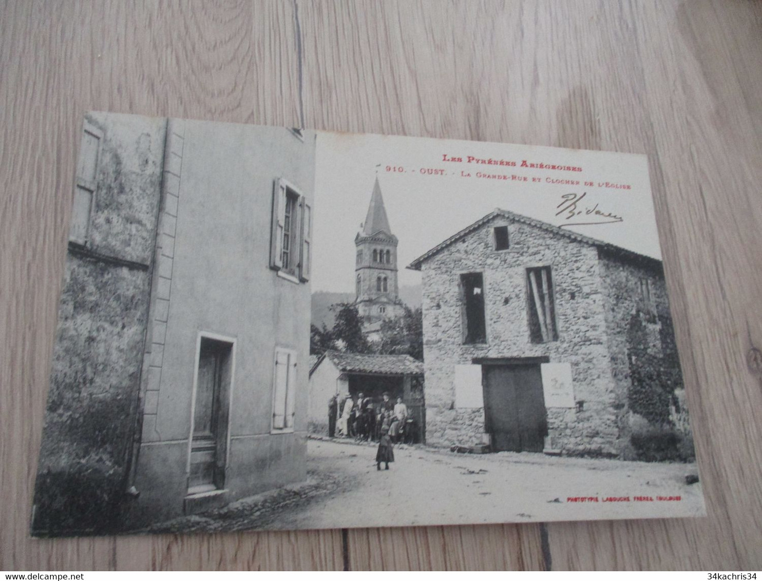 CPA  09 Ariège Oust La Grande Rue Et Clocher De L'église - Oust