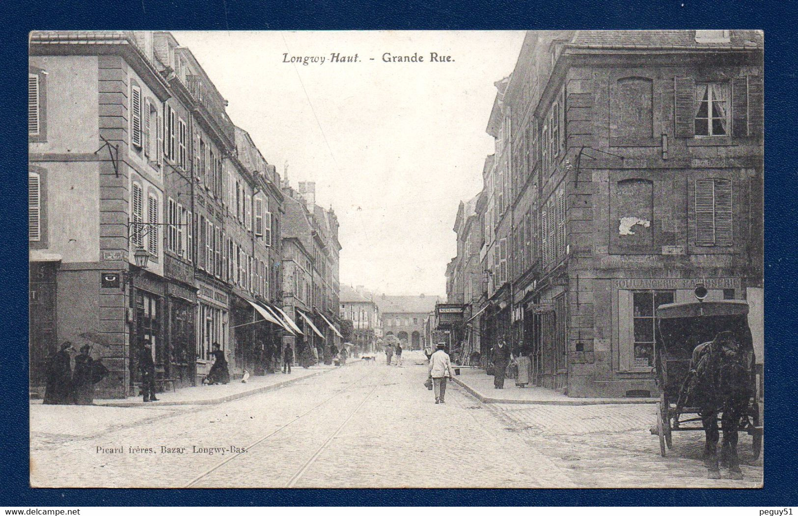 54. Longwy - Haut. Grande Rue Et Rue Abbé Friclot. Boulangerie-Patisserie. Tabac-presse Le Petit Parisien. 1907 - Longwy