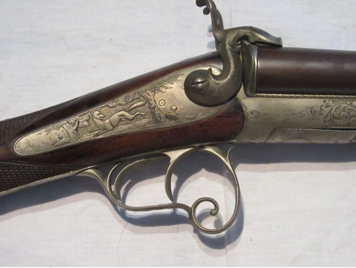 Beautiful pin fire rifle engraved with scene of hunting and animals