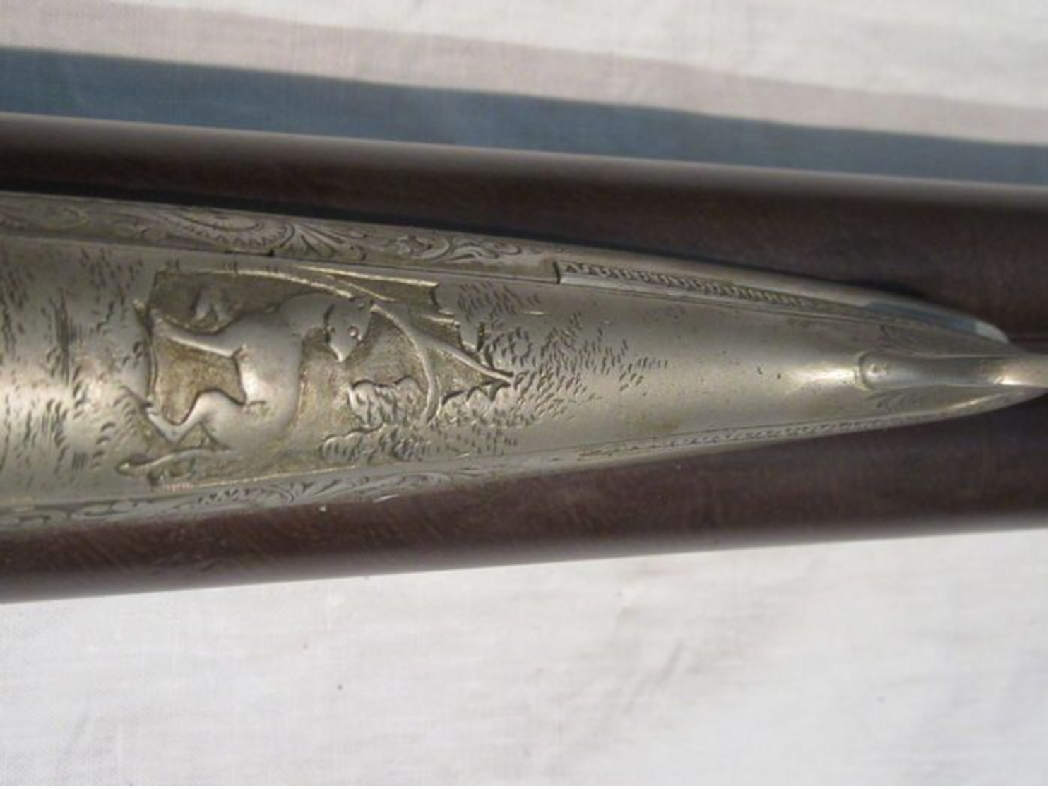 Beautiful pin fire rifle engraved with scene of hunting and animals