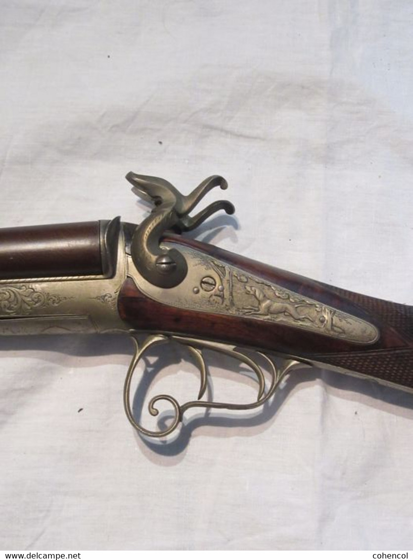 Beautiful pin fire rifle engraved with scene of hunting and animals