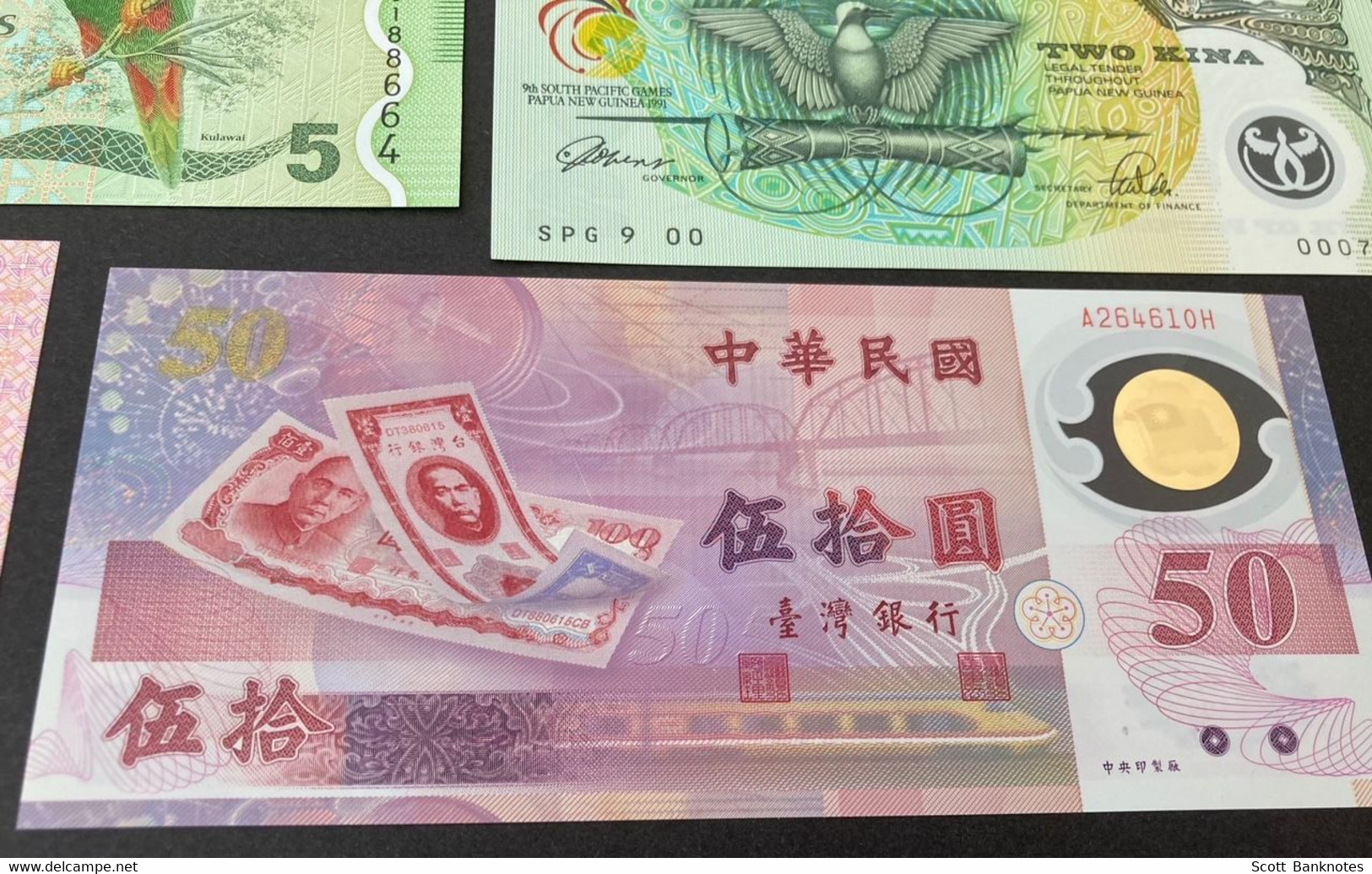 8 X Uncirculated Polymer Banknotes, inc. China, Fiji, New Guinea, Indonesia and more.