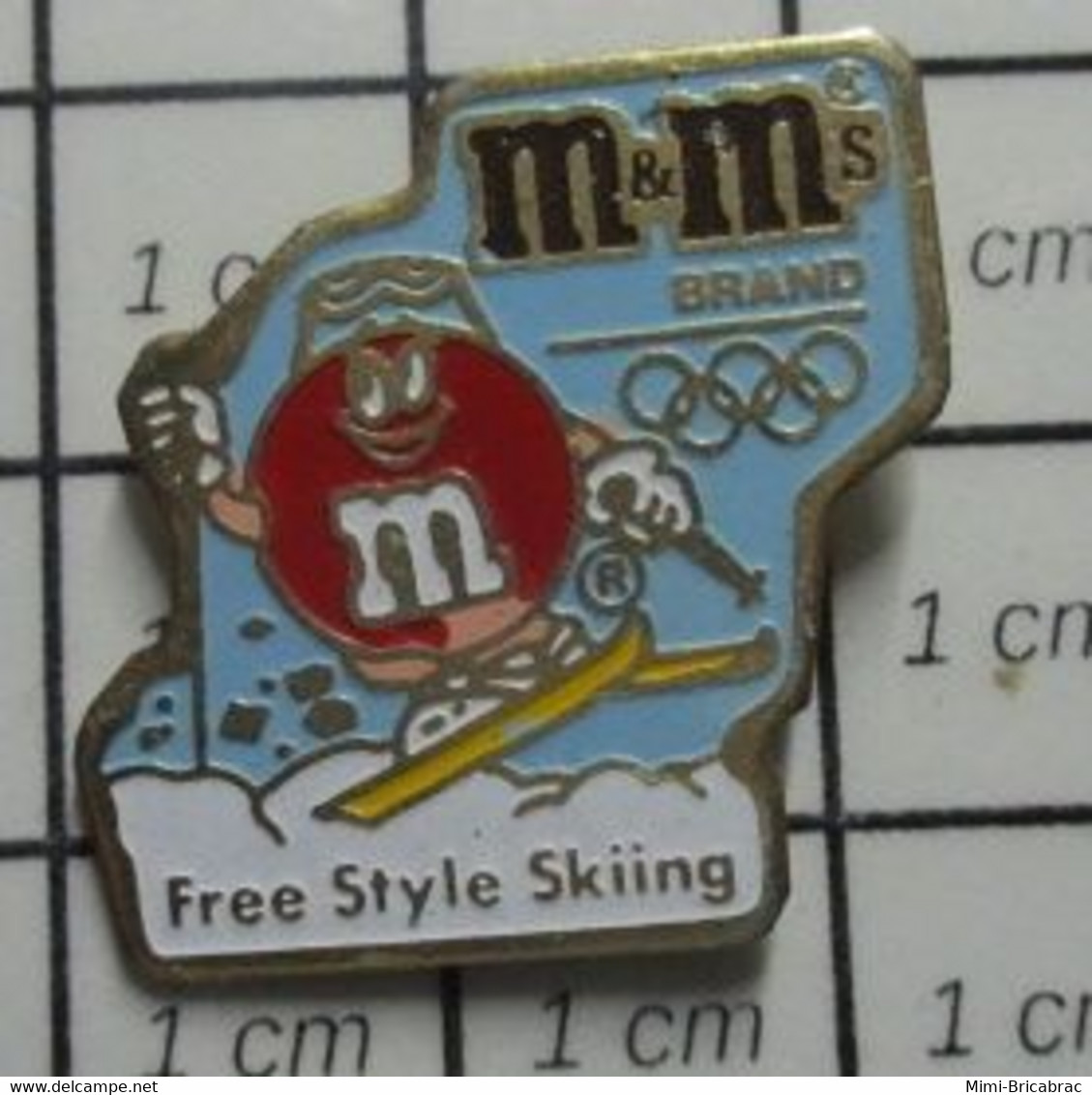 412F Pin's Pins / Beau Et Rare / THEME : JEUX OLYMPIQUES / ALBERTVILLE 1992 SKI FREE STYLE CONFISERIE M&M'S - Jeux Olympiques