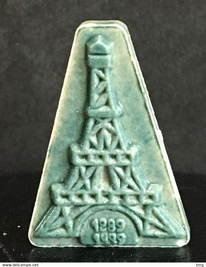 Au7 – FEVES Fève - Biscuit émaillé Vert Bleu, Centenaire Tour Eiffel 1889 - 1989 – Tmg - Histoire