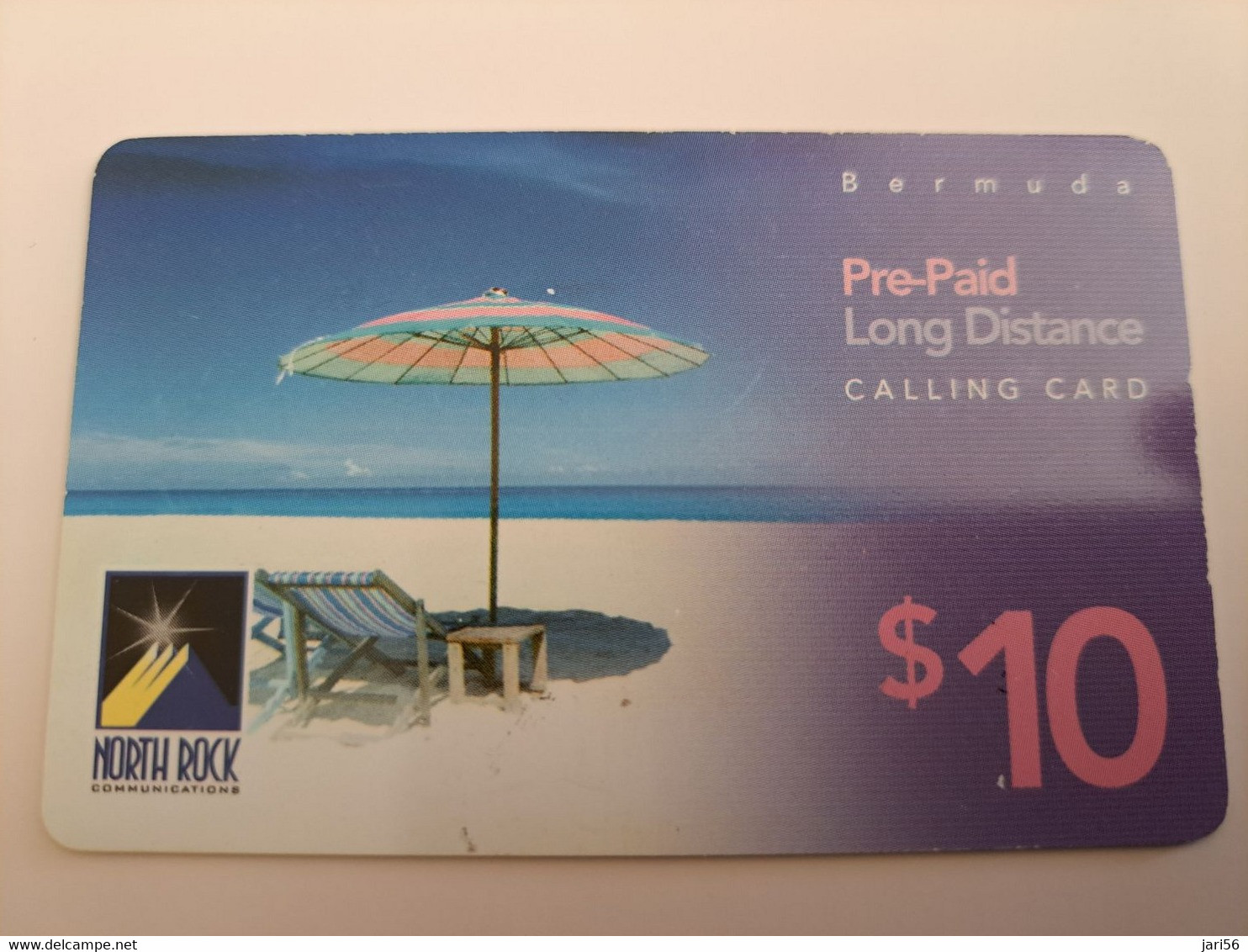 BERMUDA  $10,-,-NORTH ROCK   BERMUDA / PARASOL ON BEACH /  DIFFERENT BACK/   PREPAID CARD  Fine USED  **11269** - Bermudes