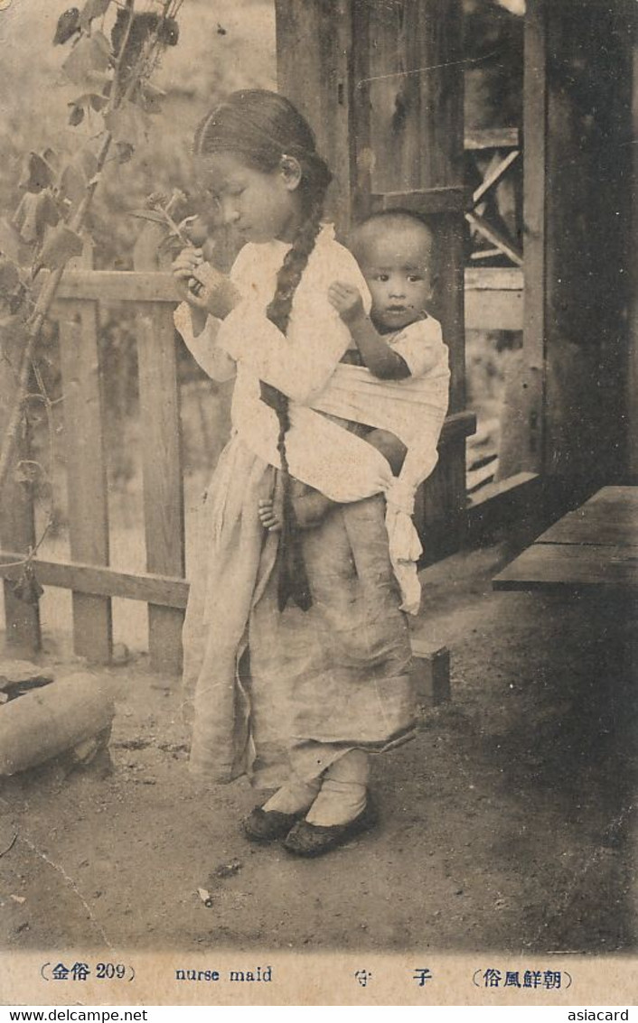 Nurse Maid Young Girl With Nice Plaid Holding Young Boy In Her Back - Korea (Nord)