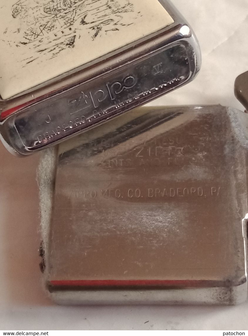 2 Briquet essence 1 Zippo Made in U.S.A Phare Navire avec son étui + 1 sans pierre ni mèche .!