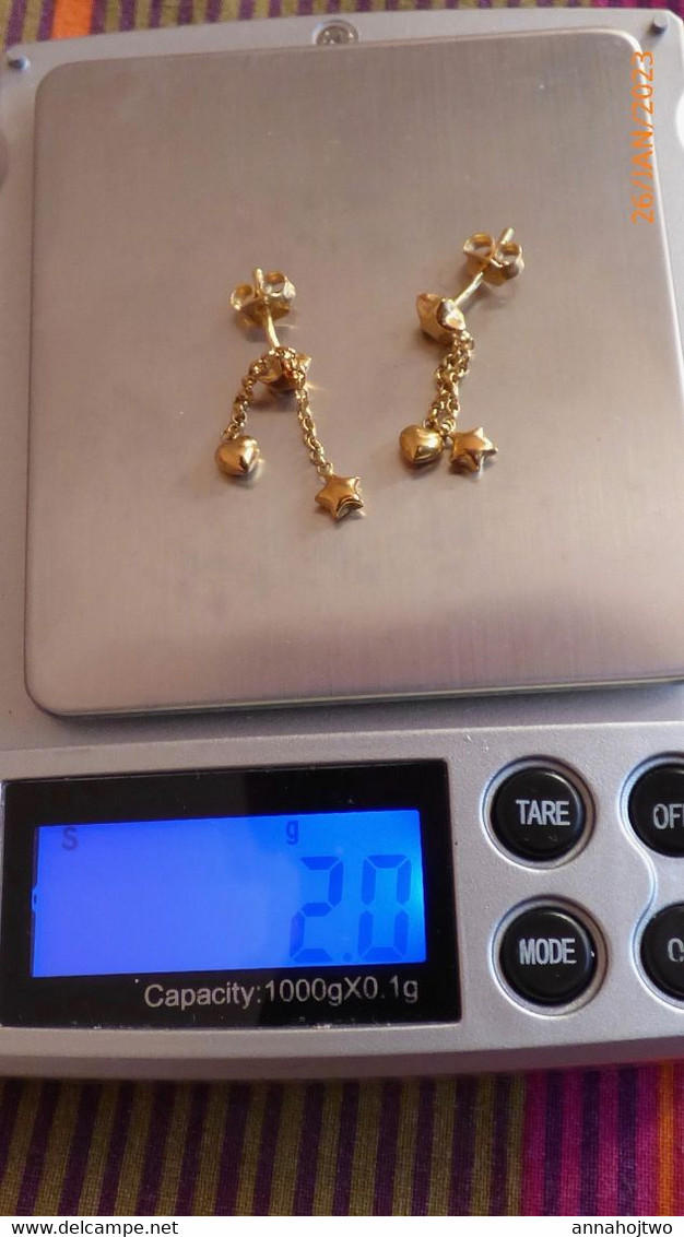 Boucles d'oreilles pendantes "étoile" en Or 18 K -poinçons français.