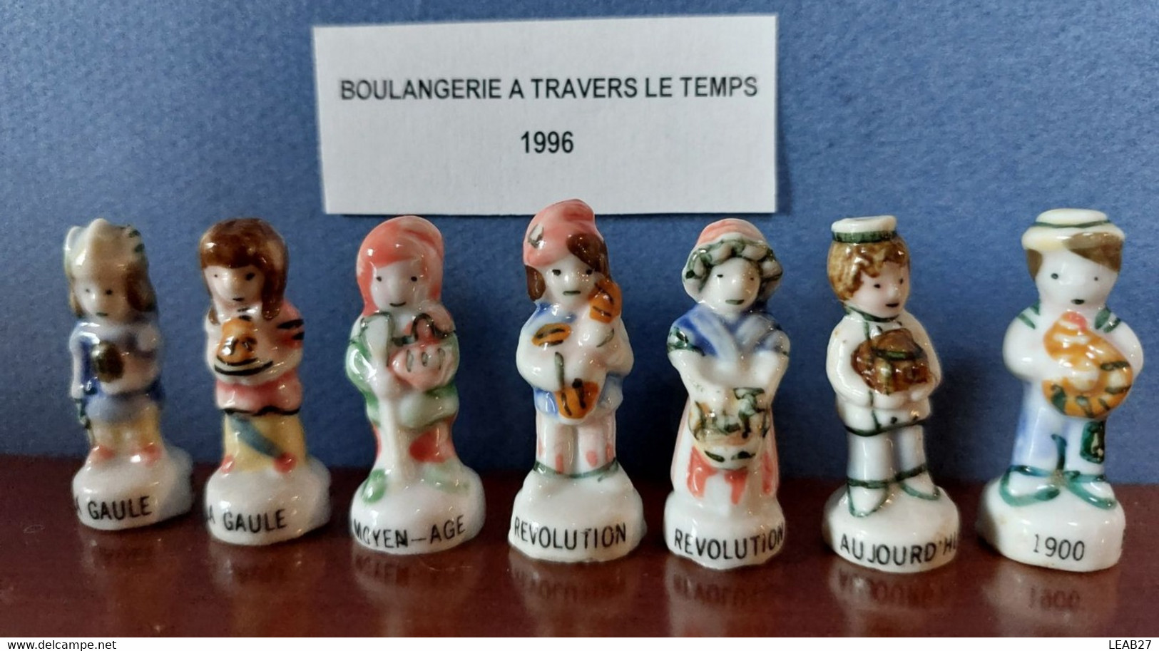 LA BOULANGERIE A TRAVERS LE TEMPS - LOT DE 7 FEVES BRILLANTES - Personnages