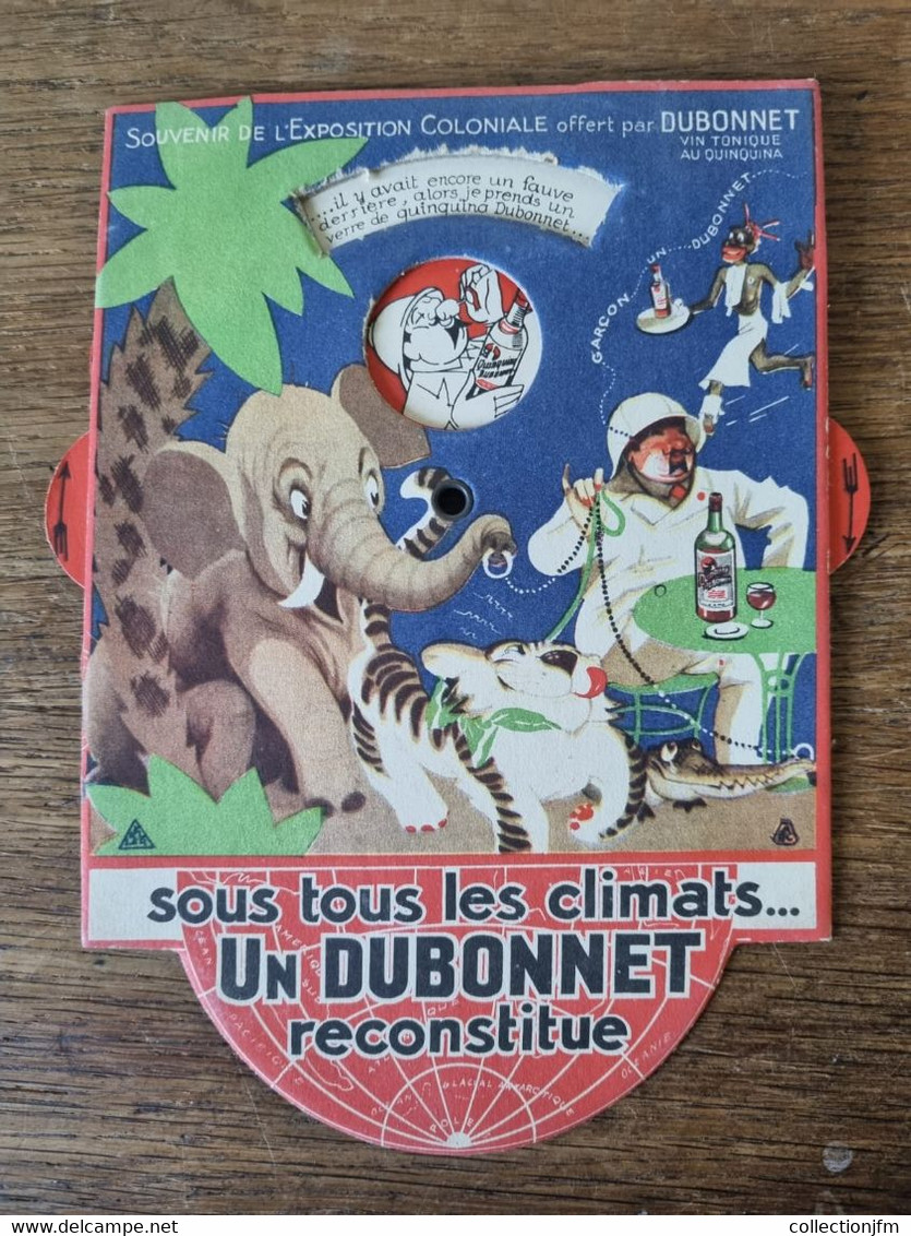 PUBLICITE CARTON AVEC ROULETTE / DUBONNET / EXPOSITION COLONIALE - Paperboard Signs