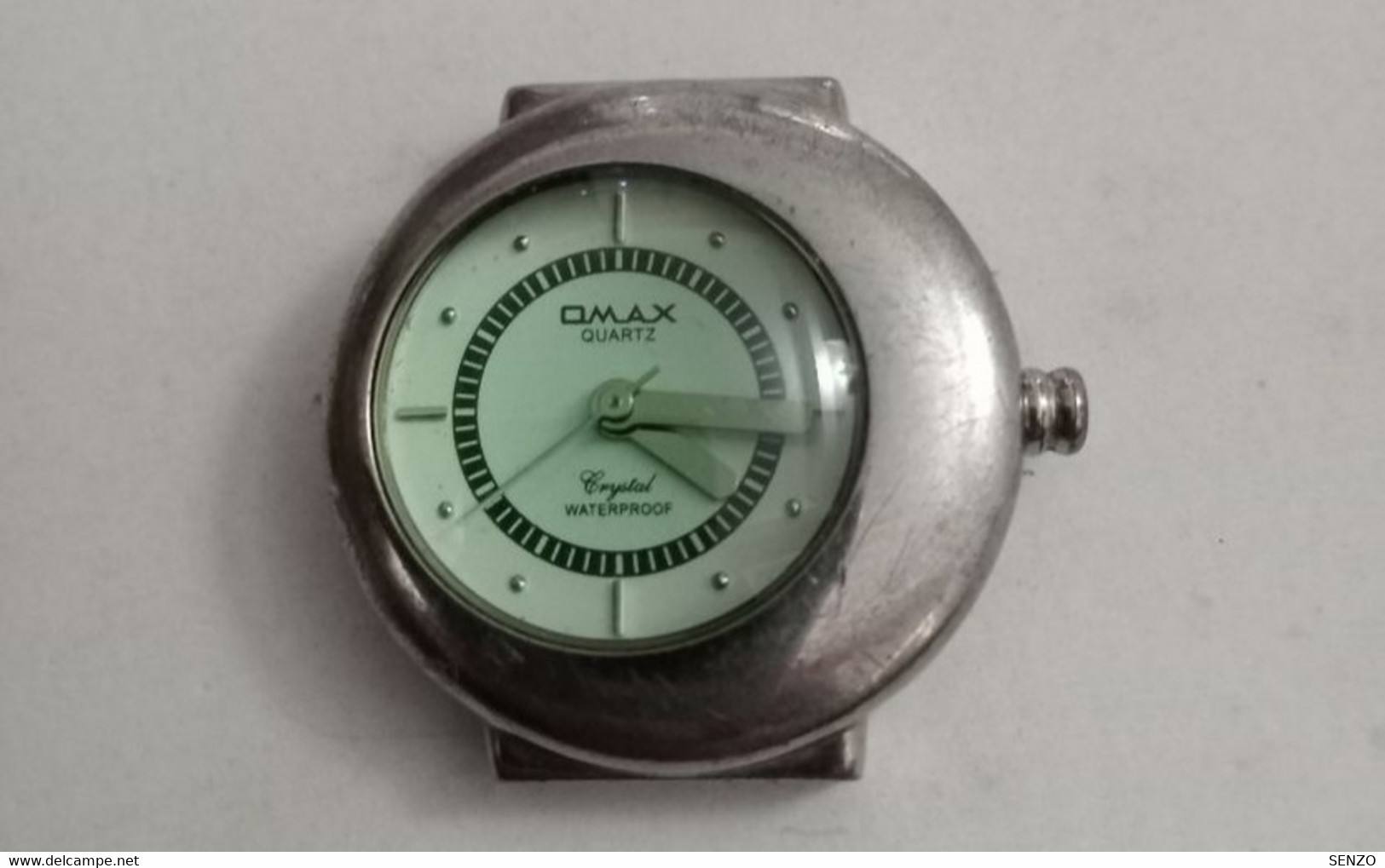Watches old MONTRE OMAX QUARTZ EN PANNE