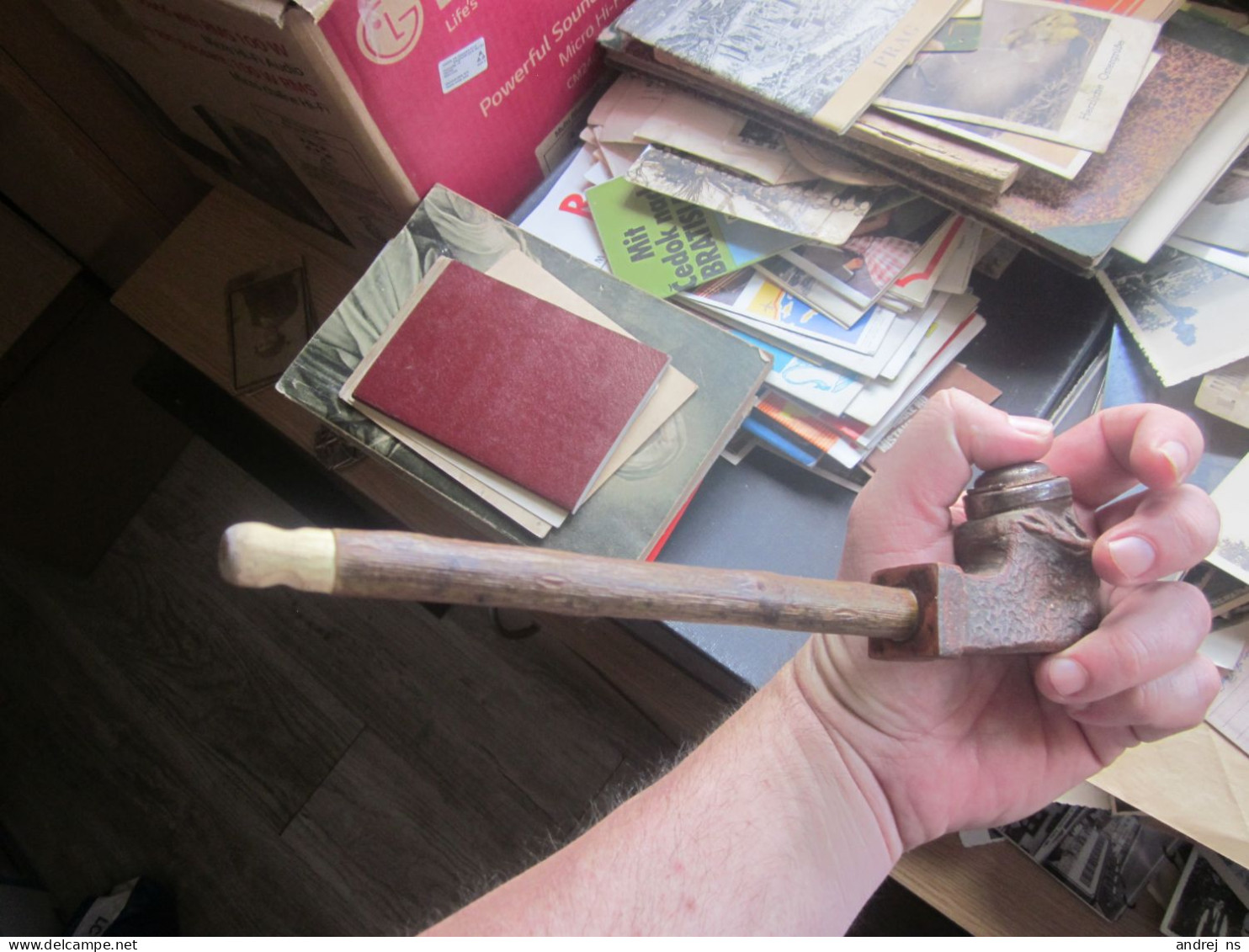 an old pipe of larger dimensions, one part is wood and the long part where you put the tobacco is some kind of ceramic