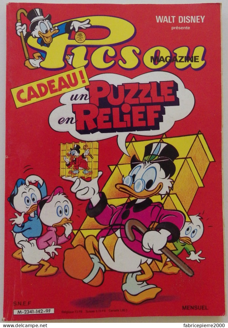 PICSOU MAGAZINE N°142 Décembre 1983 Avec Son Puzzle En Relief. Pubs Malabar, Colgate, Pac-Man Maison, Lego, PlaymoSpace - Picsou Magazine