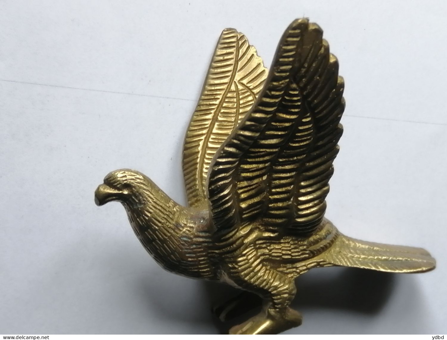 UN AIGLE EN BRONZE DORE - Bronces