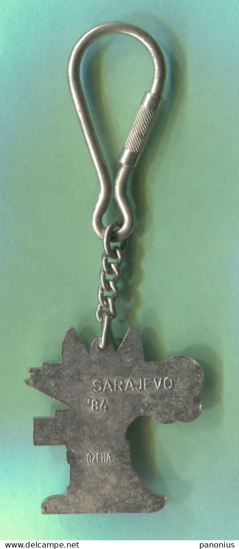 Olympiade - Olympic Games 1984. Sarajevo Yugoslavia Mascote Vučko, Enamel Vintage Keychain Keyring - Uniformes Recordatorios & Misc