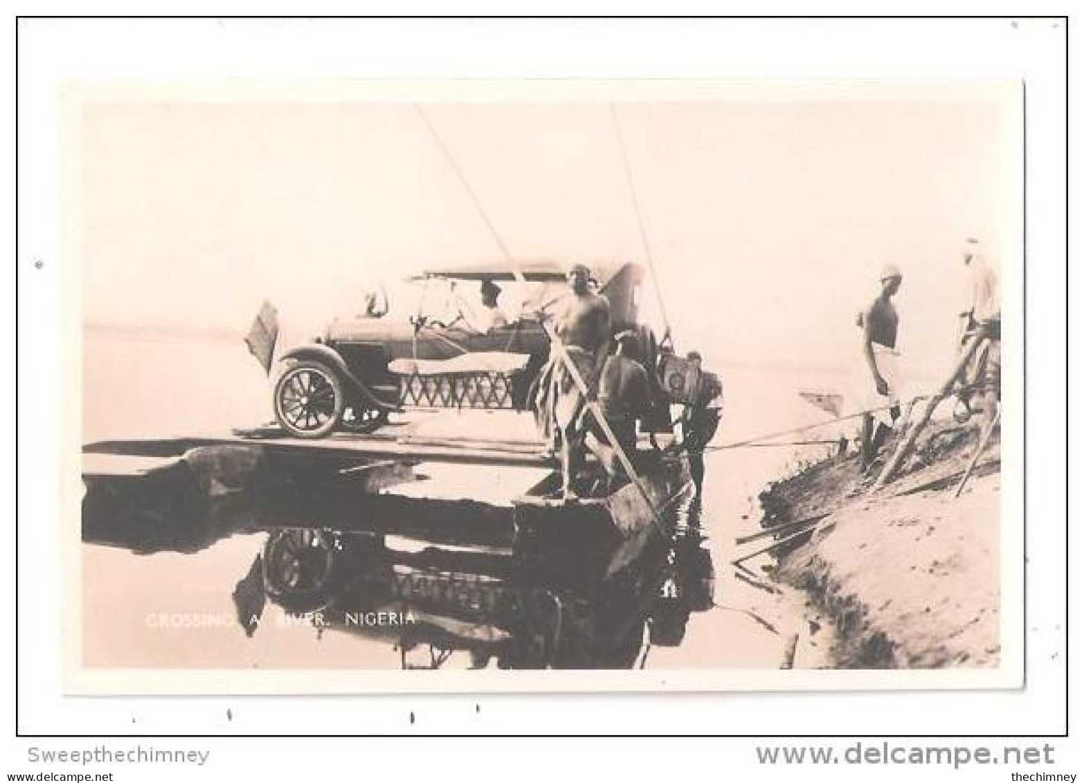 RP NIGERIA VINTAGE MOTOR CAR + PETROL CAN CROSSING A RIVER FERRY POSTCARD RP MOTORCAR COPYRIGHT CMS BOOKSHOP LAGOS - Nigeria