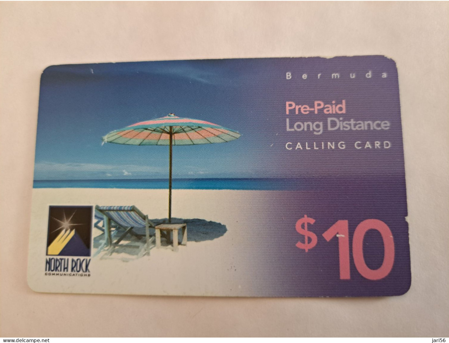 BERMUDA  $10,-,-NORTH ROCK   BERMUDA / PARASOL ON BEACH /  6/2002/   PREPAID CARD  Fine USED  **14795** - Bermuda