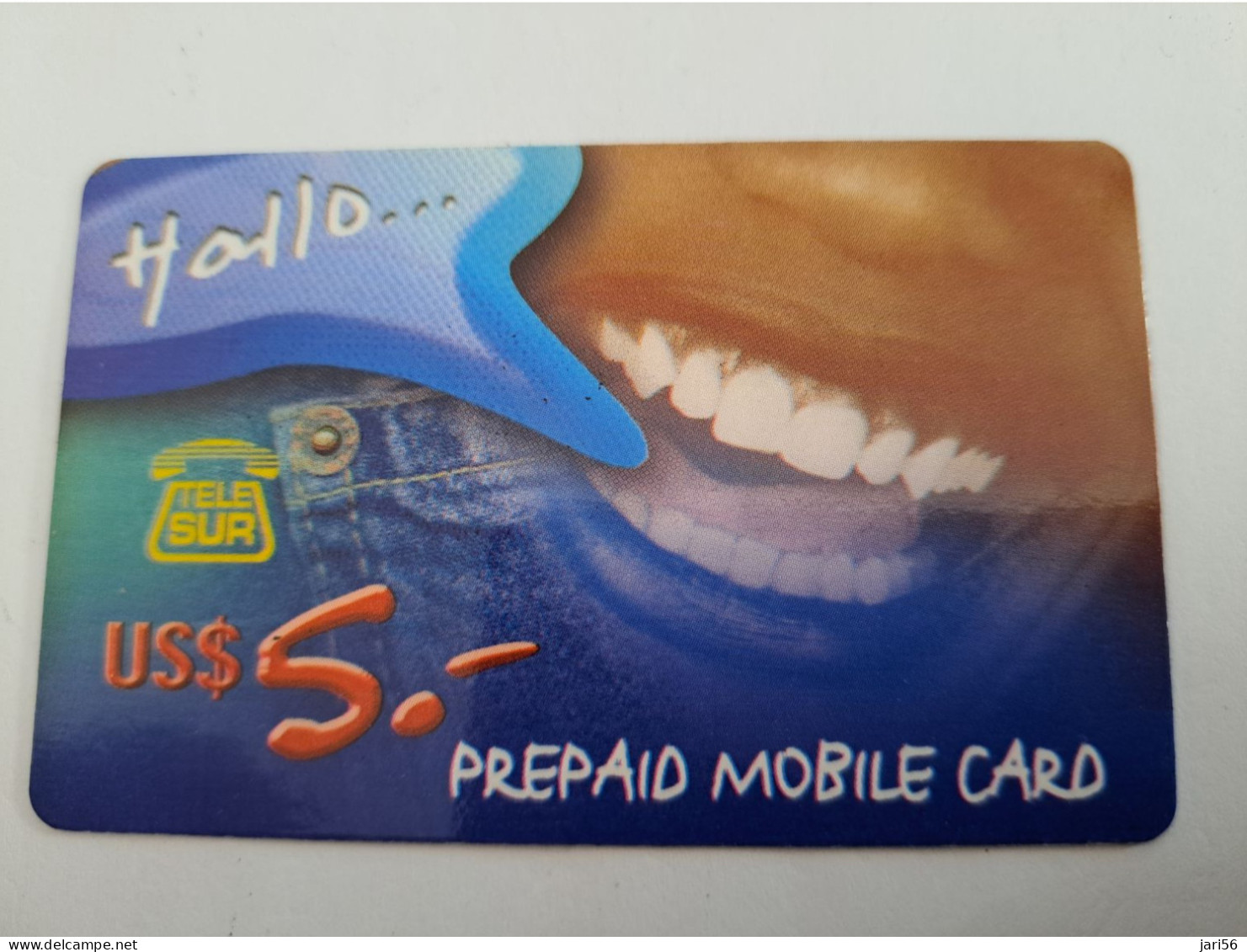 SURINAME US $ 5,-     PREPAID / TELESUR  /  FACE/ TEETH   / FINE USED CARD            **14907** - Surinam