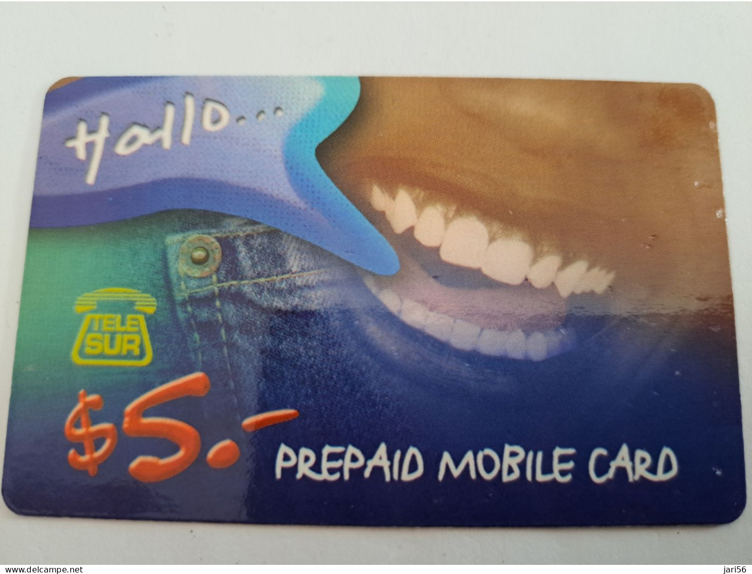 SURINAME US $ 5,-     PREPAID / TELESUR  /  FACE/ TEETH   / FINE USED CARD            **14908** - Surinam