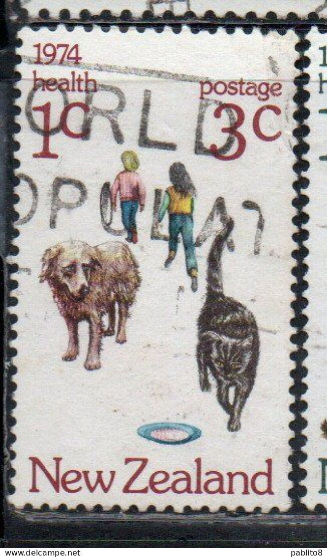 NEW ZEALAND NUOVA ZELANDA 1974 HEALTH CHILDREN WITH CAT AND DOG 3c + 1c USED USATO OBLITERE' - Used Stamps
