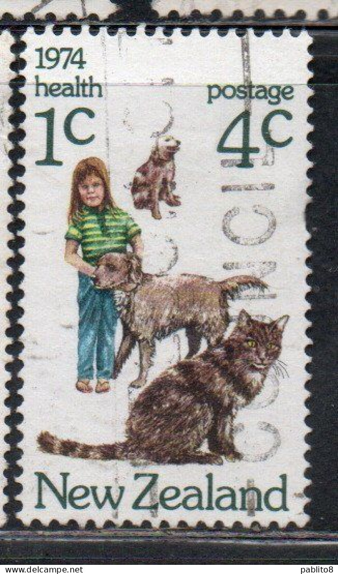 NEW ZEALAND NUOVA ZELANDA 1974 HEALTH GIRL WITH CAT AND DOG 4c + 1c USED USATO OBLITERE' - Usati