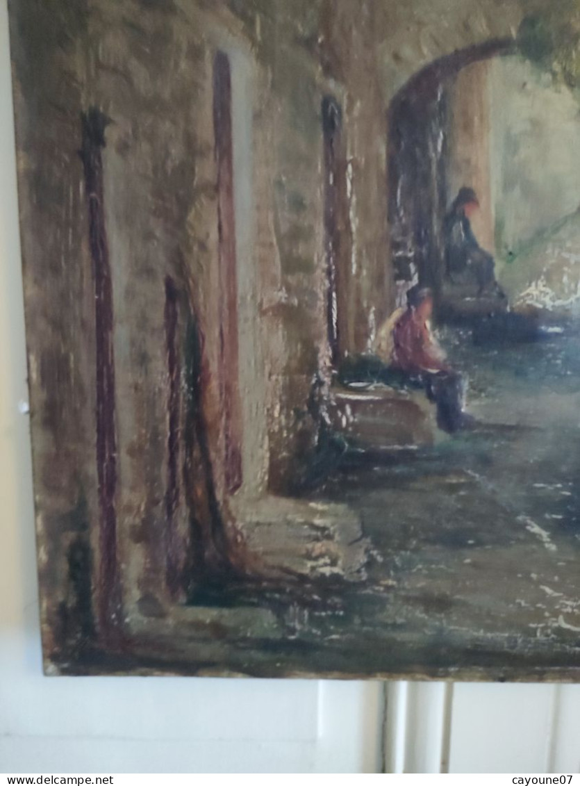 DINO SILVESTRE huile sur toile "Vieille ruelle animée de deux hommes assis et chèvres"