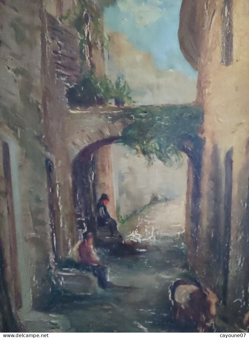 DINO SILVESTRE huile sur toile "Vieille ruelle animée de deux hommes assis et chèvres"