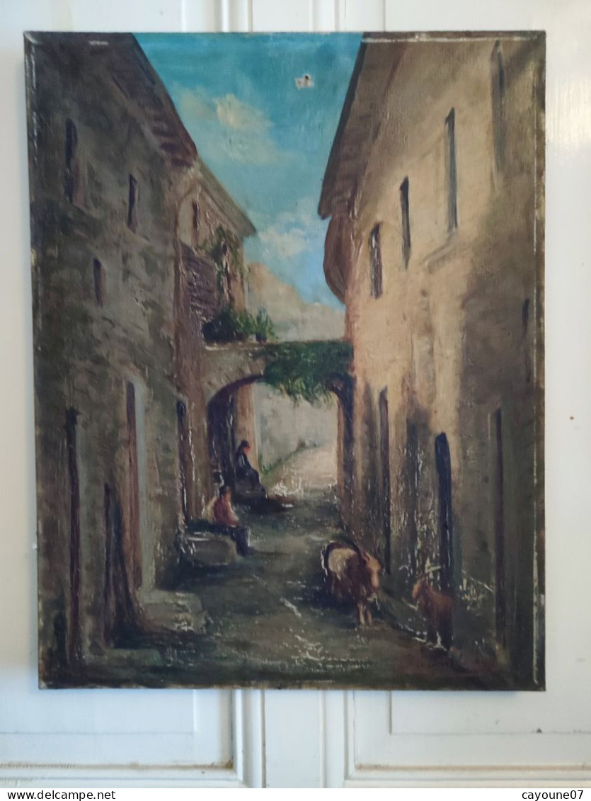 DINO SILVESTRE huile sur toile "Vieille ruelle animée de deux hommes assis et chèvres"