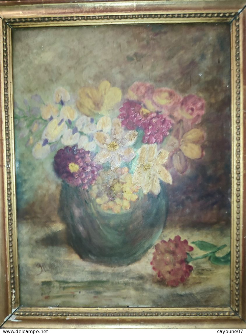 Huile sur carton signée "Nature morte au bouquet de fleurs " cadre bois doré datée 1936