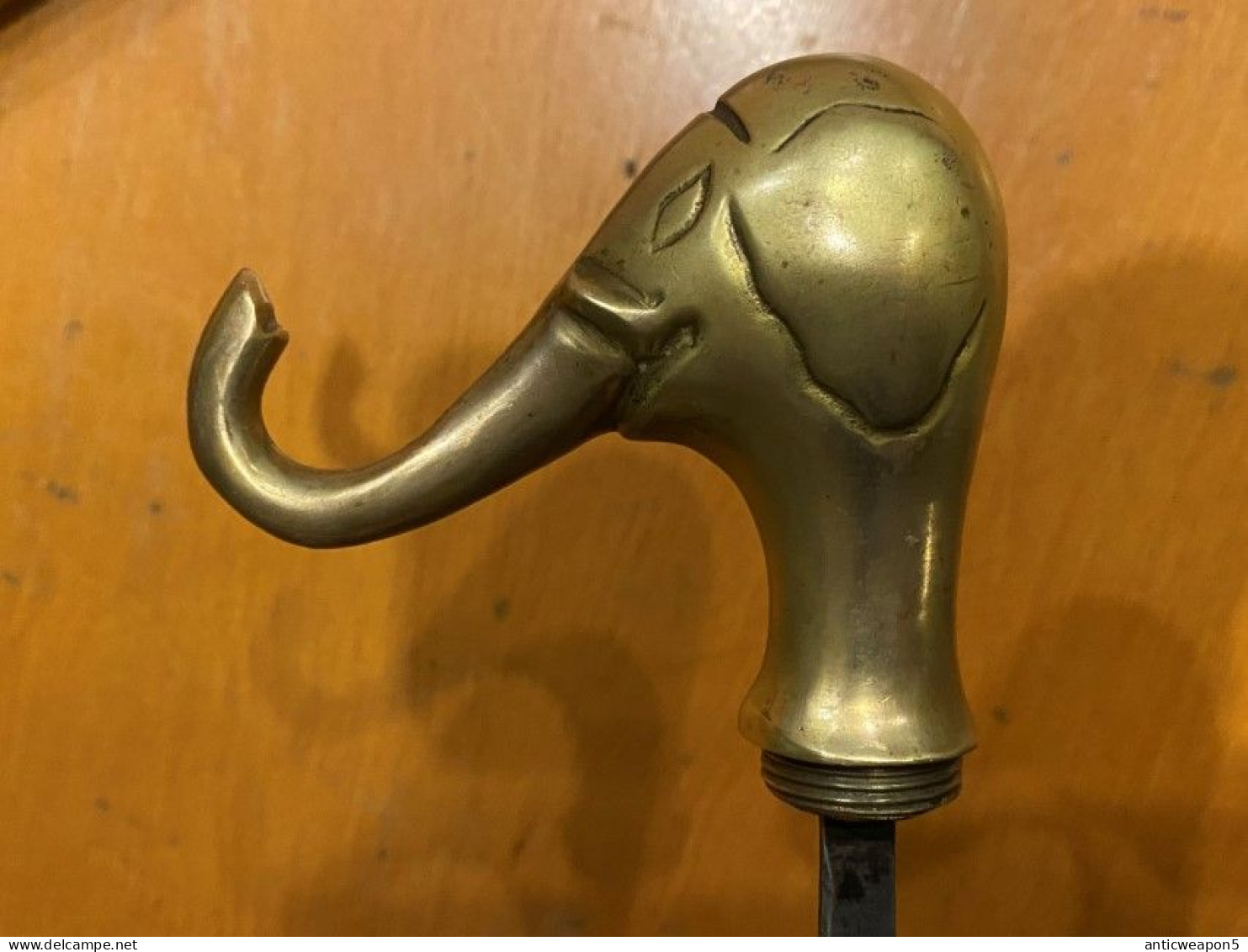 A cane with a pike inside and a heavy brass handle in the shape of an elephant's head. Europe. Around 1940. (H311)