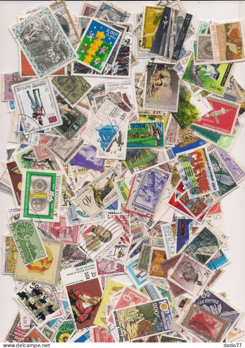 LOT DE  2 500 TIMBRES MONDE OBLITERES - Mezclas (min 1000 Sellos)