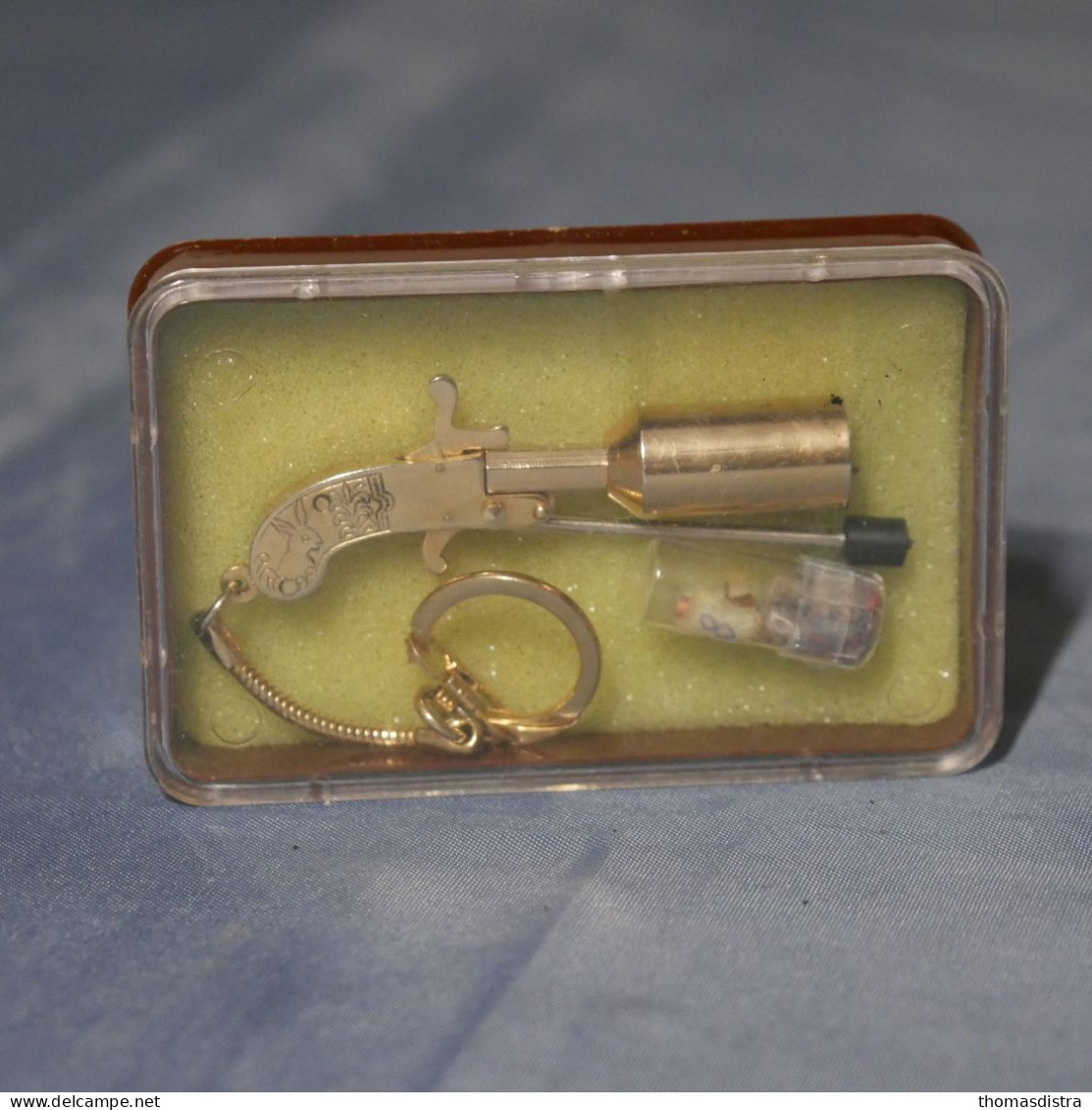Berloque le plus petit pistolet à blanc du monde serti d'or années 70 80 vintage