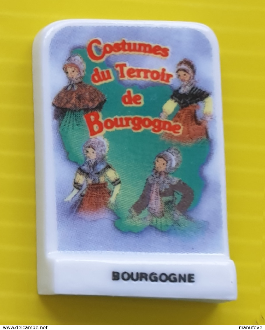 Fève - Debusne -  - Costumes De Terroirs De Bourgogne - Plaque Logo - Regioni