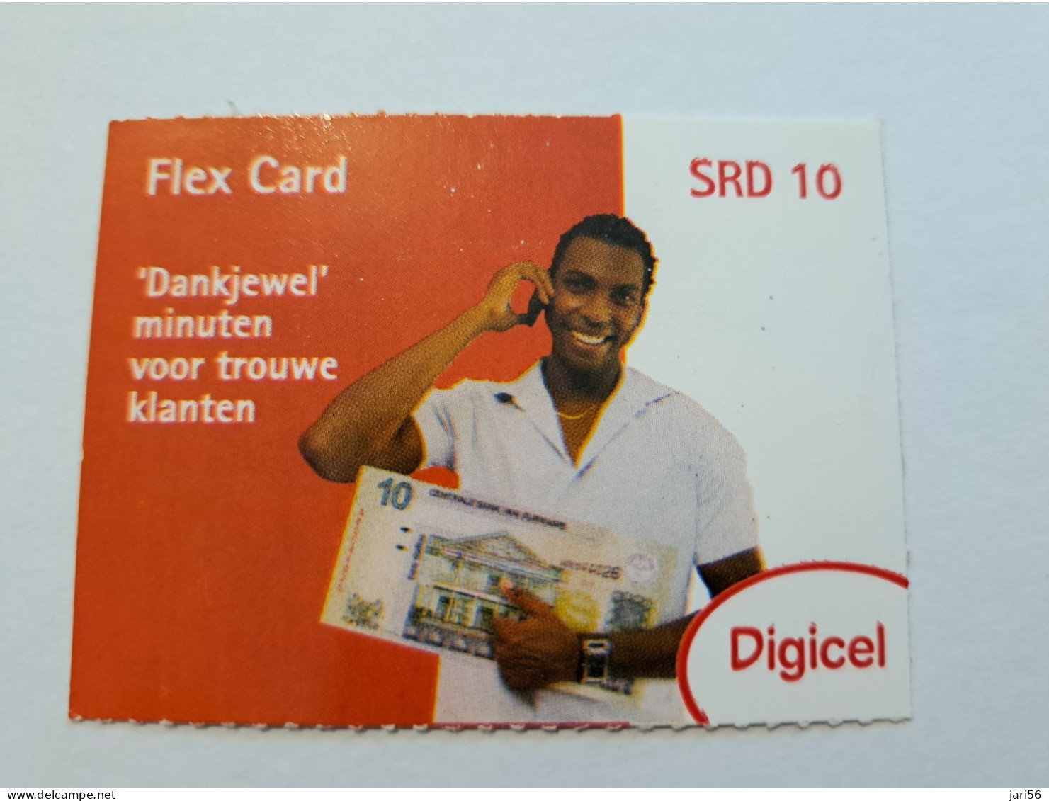 SURINAME US 10-  / DIGICEL /  UNITS GSM  PREPAID/  / MAN WITH PHONE  AND BANKNOTE      /    MOBILE CARD    **16299 ** - Suriname