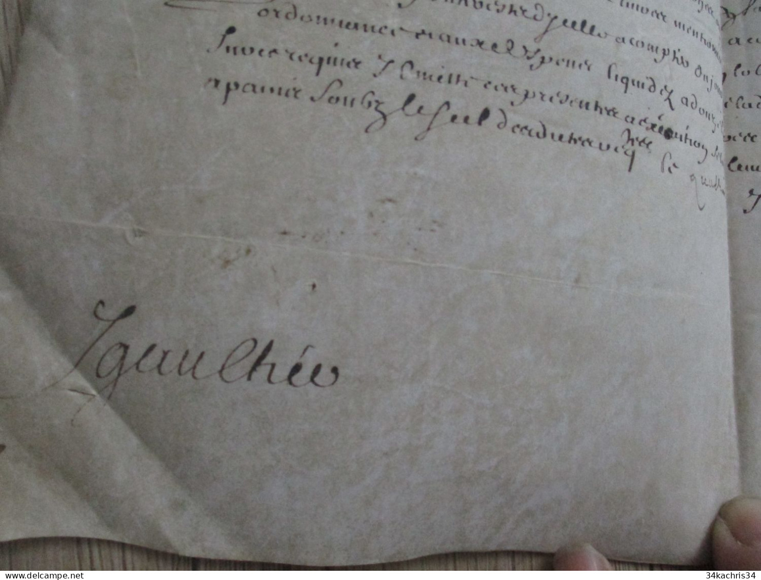 1665 pièce signée sur velin Mernost? Igaulhée condamnation à payer à déchiffrer