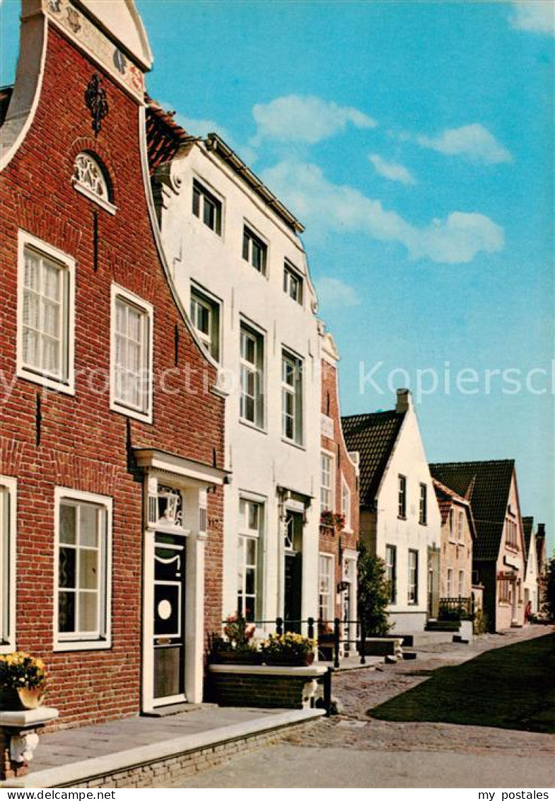 73615580 Greetsiel Friesische Haeuser Greetsiel - Krummhoern