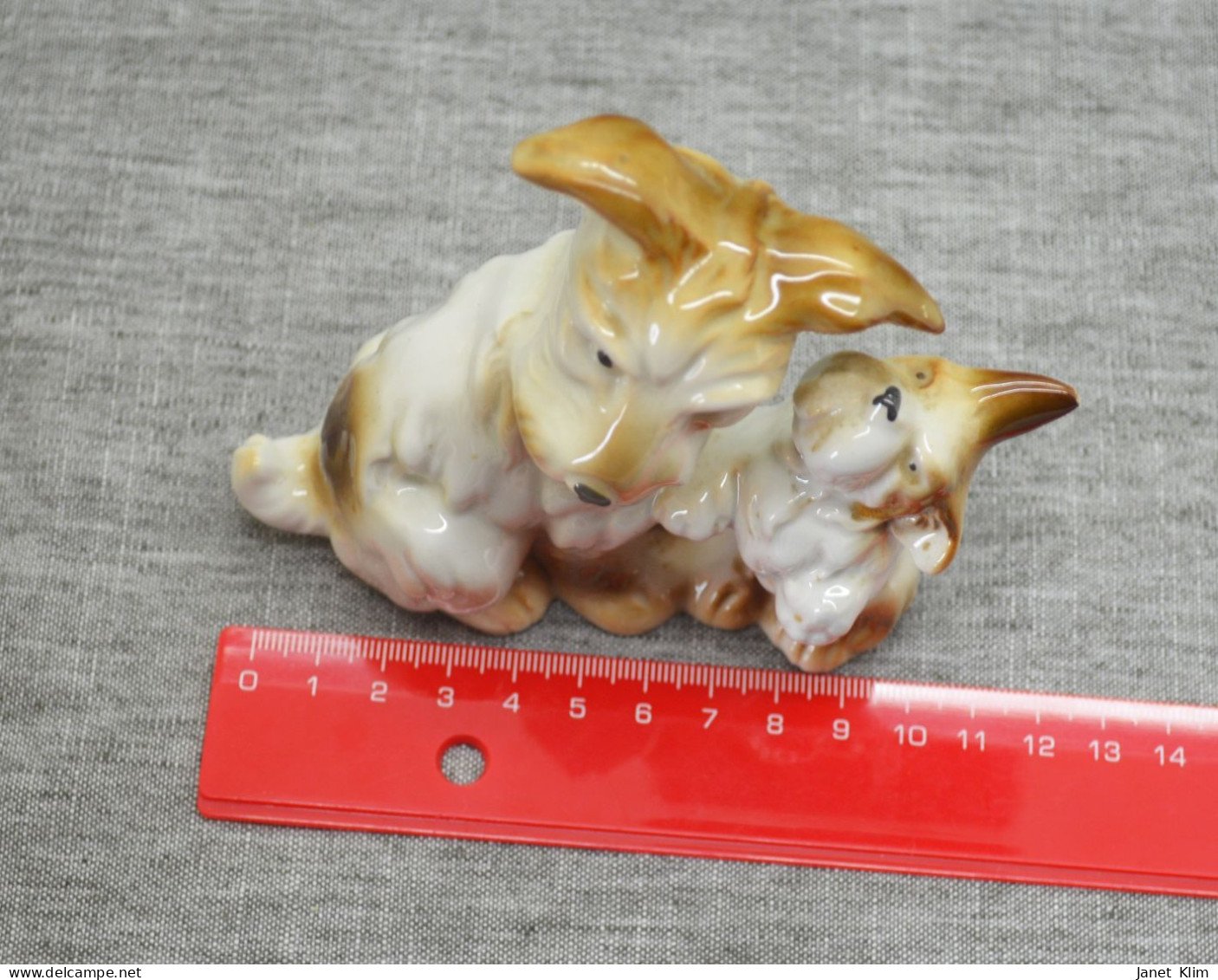 Vintage porcelain figurine of a dog with a puppy