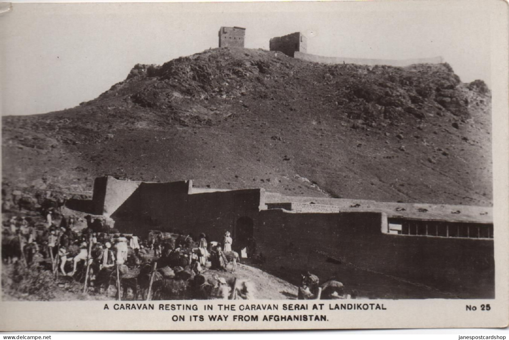 REAL PHOTOGRAPHIC POSTCARD - A CARAVAN RESTING IN THE CARAVAN SERAI AT LANDIKOTAL PAKISTAN ON ITS WAY FROM AFGHANISTAN - Pakistan