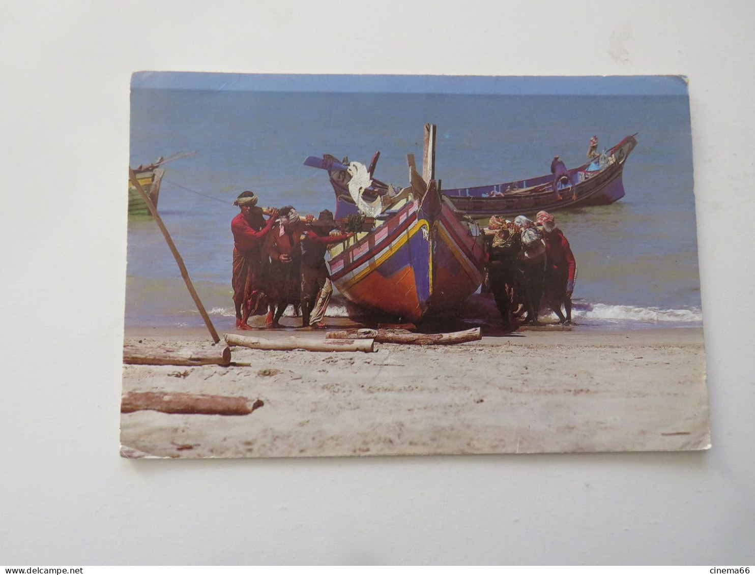 Fishermen Pushing Their Boat Towards The Beach. - Malesia