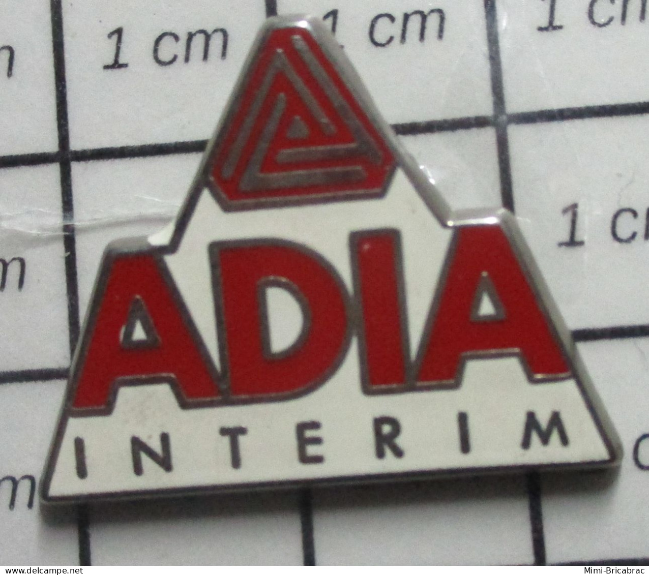 511D  Pin's Pins / Beau Et Rare / MARQUES / TRAVAIL TEMPORAIRE ADIA INTERIM Par PLESSIS - Marcas Registradas