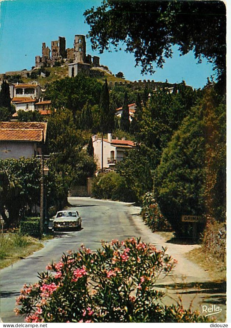 Automobiles - Grimaud - L'entrée Du Village Et Les Ruines Du Château Médiéval - Fleurs - CPM - Voir Scans Recto-Verso - PKW